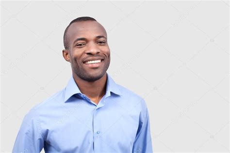 Young Black Man Smiling At Camera Stock Photo By ©gstockstudio 37034497