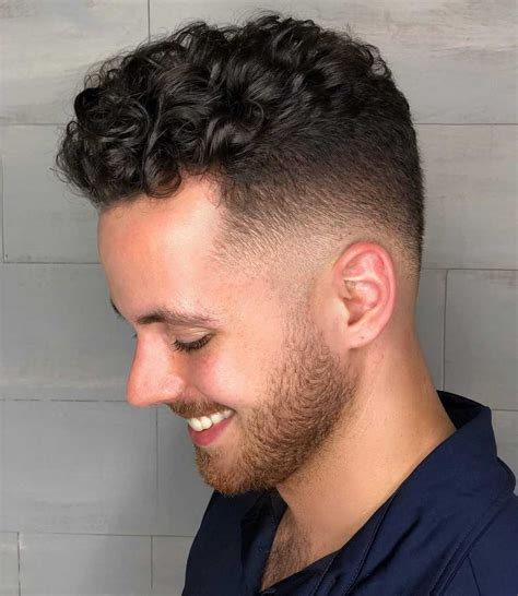 Hop into this hot trend and start by looking into these popular photos of the faux hawk fade haircuts below! 16 Awesome Examples of Curly Hair Fade Haircuts - Latest Haircuts for Men