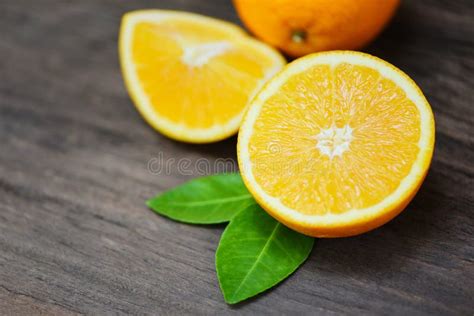 Orange Fruit On Wooden Background Fresh Orange Slice Half And Orange