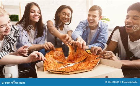 Time For Snack Happy Students Eating Pizza And Chatting Stock Image