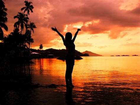 Silhouette Ow Woman Standing On Water During Sunset Hd Wallpaper Wallpaper Flare
