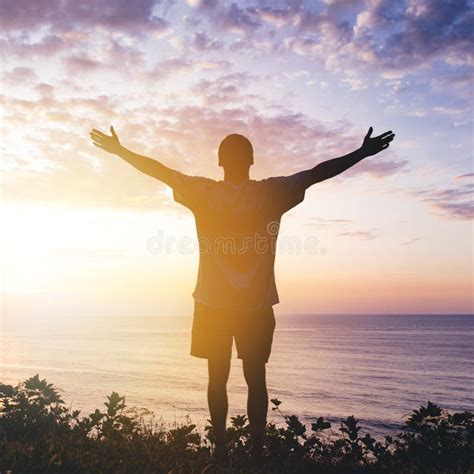 Climber Arms Up Outstretched On Mountain Top Looking At Inspirational