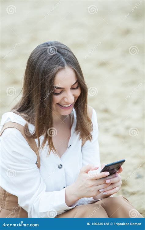 Girl Outdoors Texting On Her Mobile Phone Girl With Phone Portrait Of A Happy Woman Text Sms