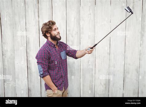 Happy Hipster Using Selfie Stick Stock Photo Alamy