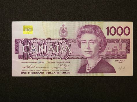 One hundred dollars isolated on white background. 1988 $1000 DOLLAR BILL BANK NOTE CANADA BIRD SERIES ...