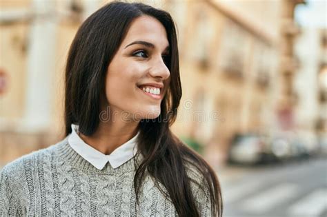 Young Hispanic Woman Smiling Happy Standing At The City Stock Image
