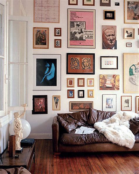 Build a photo wall with a bunch of family pictures, or opt for frames sans photos to create a wall frame collage—it's up to you. NEONSCOPE - 10 Creative Gallery Wall Ideas