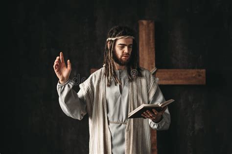 Holy Jesus Christ Praying With Biblical In Hands Stock Image Image Of