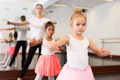 Dance Teacher Helping Her Little Girls Students Stock Photo Image Of
