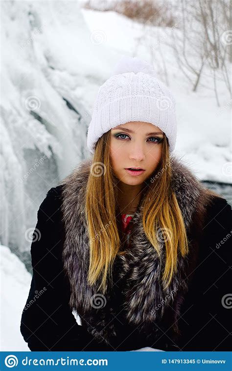 beautiful girl in winter in a dress and at the waterfall stock image image of city fashion