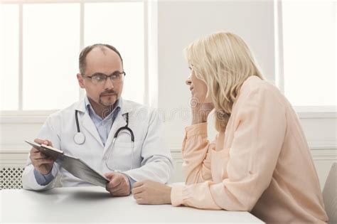 Doctor Consulting Woman In Hospital Stock Image Image Of Personal
