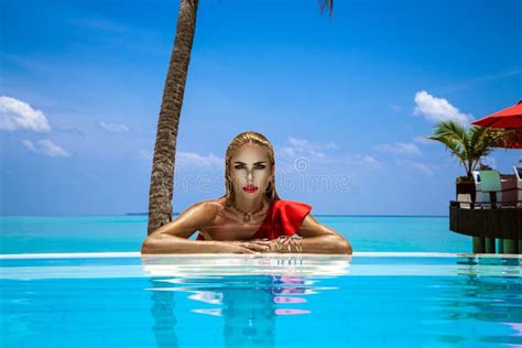 Elegant Tanned Woman In Red Swimsuit In Pool On Tropical Maldives Island Beautiful Bikini Girl