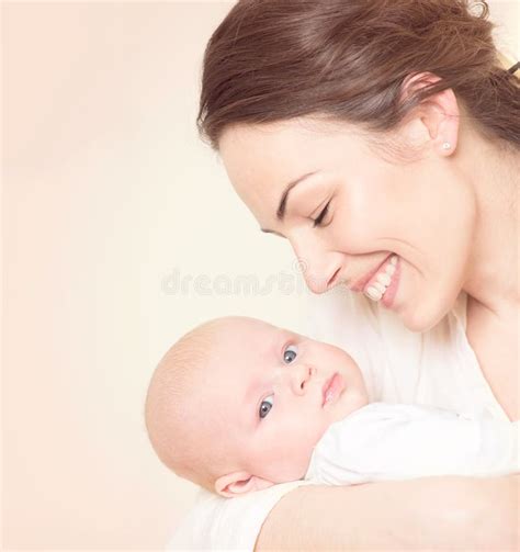 Mother And Her Newborn Baby Together Happy Mother And Baby Kissing And