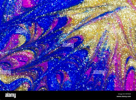 Abstract background of colorful metallic pink, blue, silver and gold