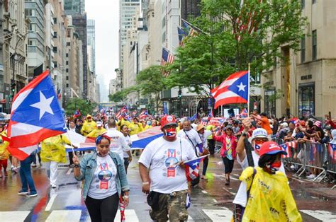 historic 65th annual puerto rican day parade in new york city with a crowd of people watching