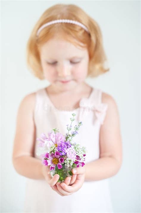 Child Holding A Bouquet Of Summer Flowers Stock Photo Image Of Pretty