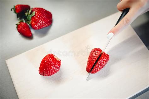 Strawberries On A Cutting Board With A Knife Stock Photo Image Of