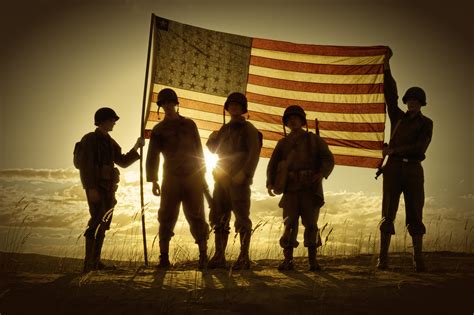 Wwii Soldiers Standing In A Flag Draped Sunset Silhouette