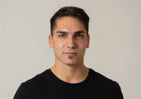 Natural Portrait Of Young Attractive Man In His 20s Looking And Posing