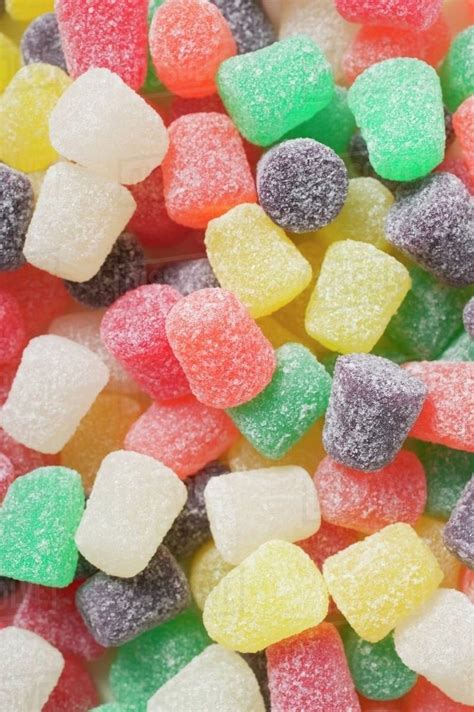 Coloured sugar-coated jelly sweets (full-frame) - Stock Photo - Dissolve