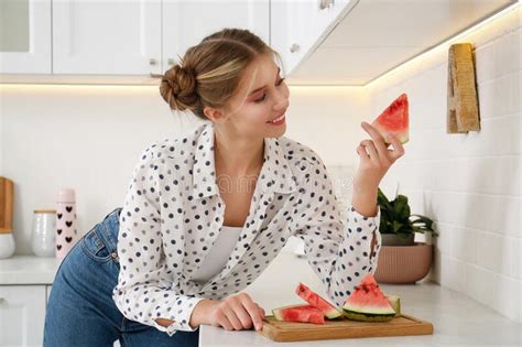 Beautiful Teenage Girl With Slice Of Watermelon Near Countertop In