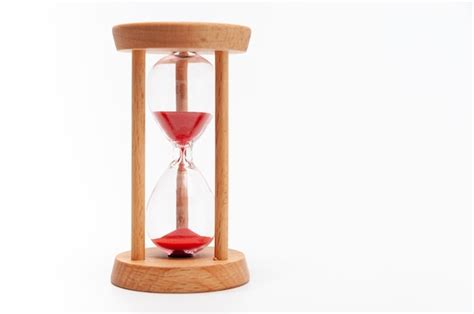 Premium Photo Old Hourglass With Red Sand Isolated On A White Background