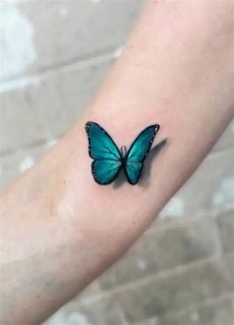 A Small Blue Butterfly Tattoo On The Arm