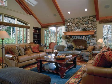 An elegant formal living room featuring hardwood flooring and a vaulted ceiling with beams lighted by a modish chandelier. Vaulted Ceiling Living Room Design Ideas