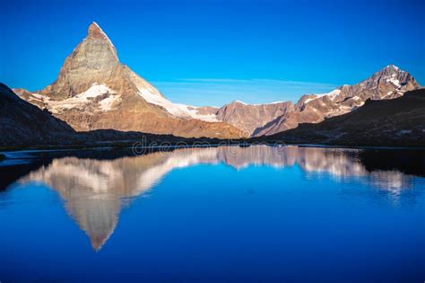 Reflection Of The Matterhorn On Blue Lake At Sunrise Swiss Alps