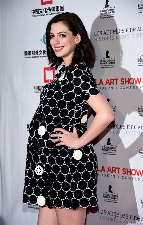 Anne Hathaway Shows Off Her Growing Baby Bump On The Red Carpet — See