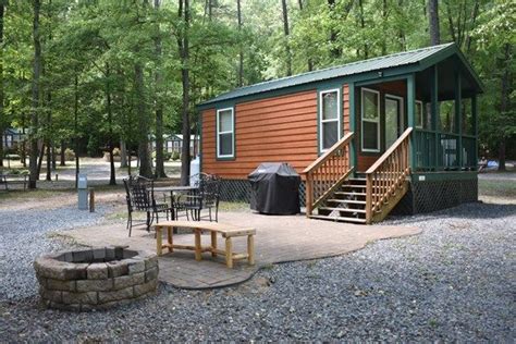 Painted in cheery hues, all have a porch, fireplace, luxe bedding, kitchenette, and bath with heated floor. Deluxe Studio Cabin with patio complete with gas grill and ...