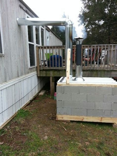 A cheap out-side wood stove that works great!!! #outdoorwood | Outdoor