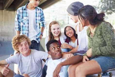 See more ideas about friends hanging out, friend pictures, friend photos. Teenage friends hanging out talking at skate park - Stock ...