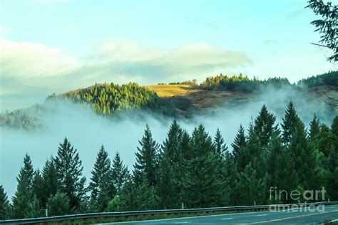 Misty Mountains View From Highway Of Distant Mountaintop In The