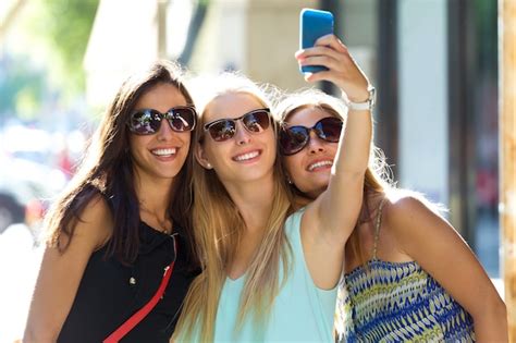 Group Of Friends Taking Selfie In The Street Photo Free Download