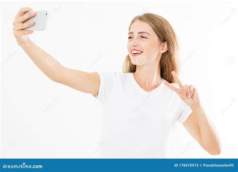 cute woman in dress taking a selfie isolated on white background copy space female hand hold