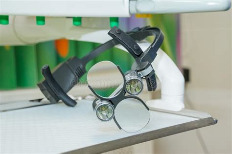 The Dental Binocular Loupes On White Tablel In Dental Office Dentist Goggles Protective