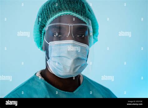 African Doctor Wearing Personal Protective Equipment Fighting Against