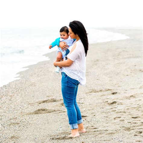 Young Mother With Her Baby On The Beach Stock Photo Image Of Outdoors