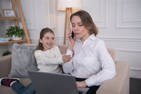 Concentrated Mother Talking On The Phone Stock Photo Image Of Child