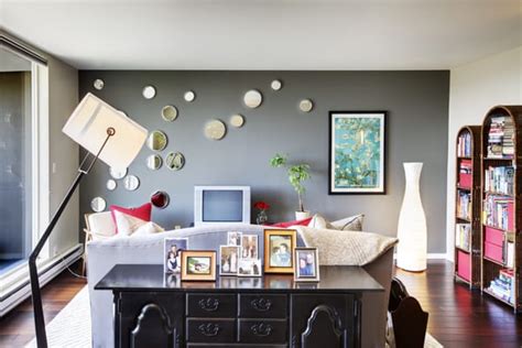 This wooden accent wall from champagne.chaos is a great idea if your living room lacks a standard fireplace or mantle. The gray accent wall provides a crisp and calm atmosphere in this Queen Anne living room. | Yelp