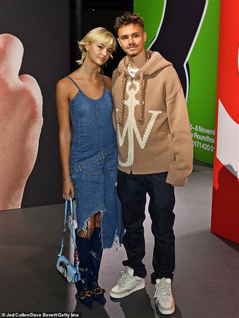 Romeo Beckham Puts On A Cosy Display Alongside Girlfriend Mia Regan As