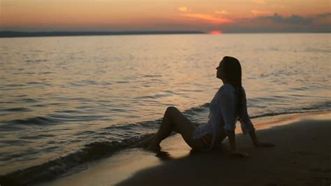 Scenes of naturalistic small talk are fine enough, but hong's drama grinds along whenever characters start to declaim, or make veiled proclamations about marriage and personal freedom. Girl Sitting On The Beach At Night Stock Footage Video ...