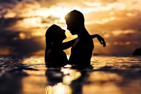 Sunset Silhouette Of Couple Kissing In Water Photo By Two Mann