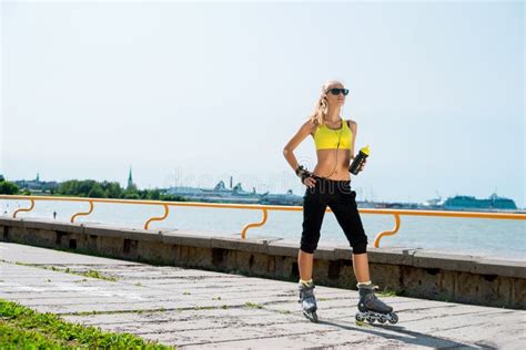 Young Beautiful Sporty And Fit Girl Rollerblading Stock Image Image