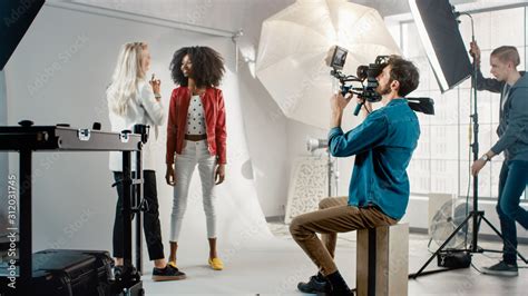 Cameraman Filming Make Up Artist Applies Makeup To A Beautiful Black