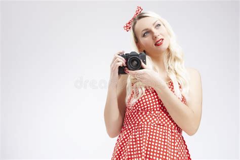 Pin Up Girl Concepts Caucasian Blond Girl Posing In Pin Up Style And Holding Retro Film Camera