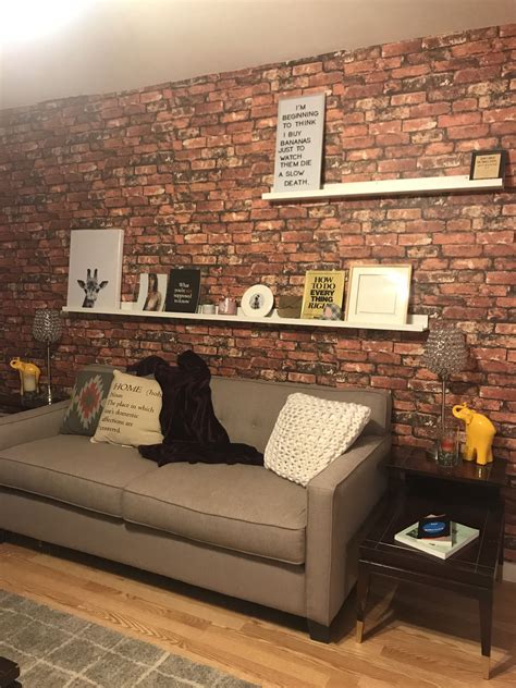 Picture Ledge Brick Wall Grey Couch And Color Accents Living Room Brick