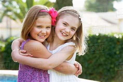 Girls Hugging Each Other Stock Photo Dissolve