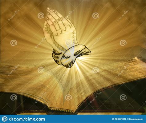 Praying Hands On Open Bible With Burst Of Light Royalty Free Stock